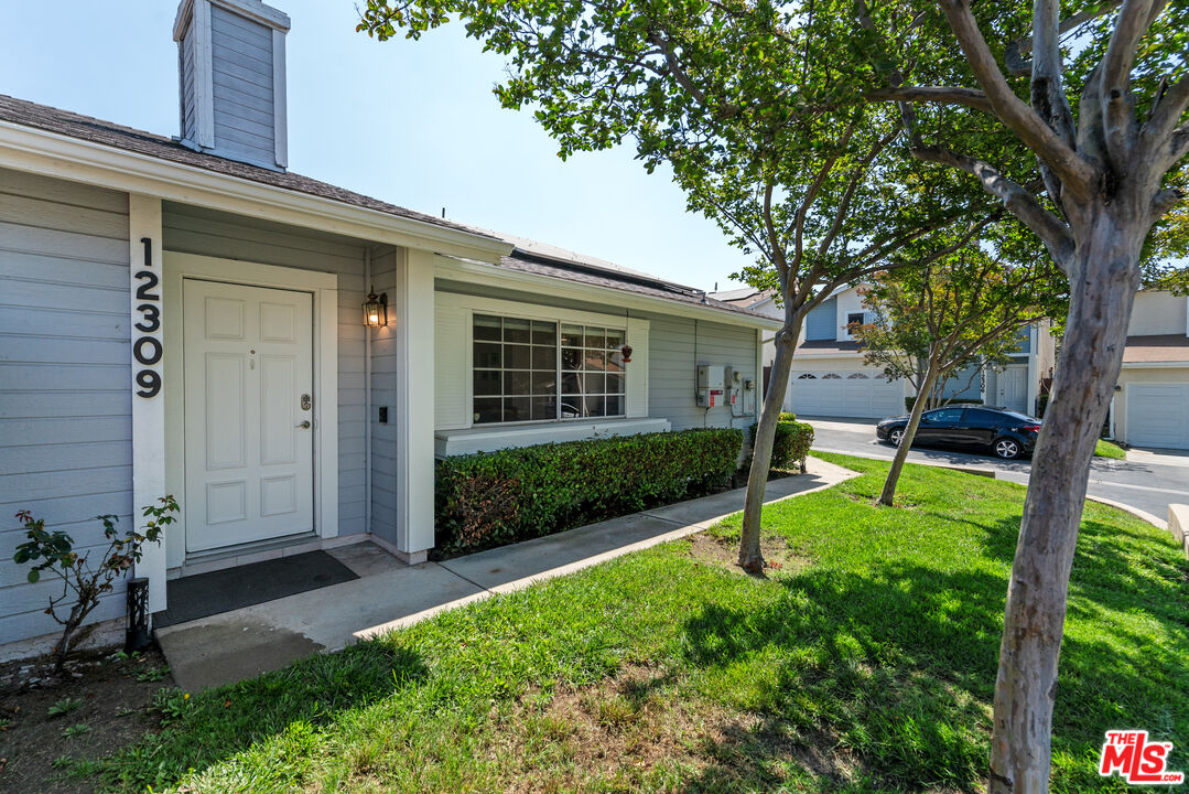 12309 Clover Road Pacoima, CA 91331 - Photo 2 of 15 front view of a house with a yard