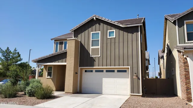 a front view of a house with garage