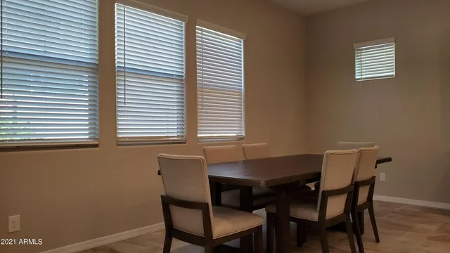 a view of a dining room with furniture and window