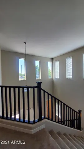 a view of a pathway along the house