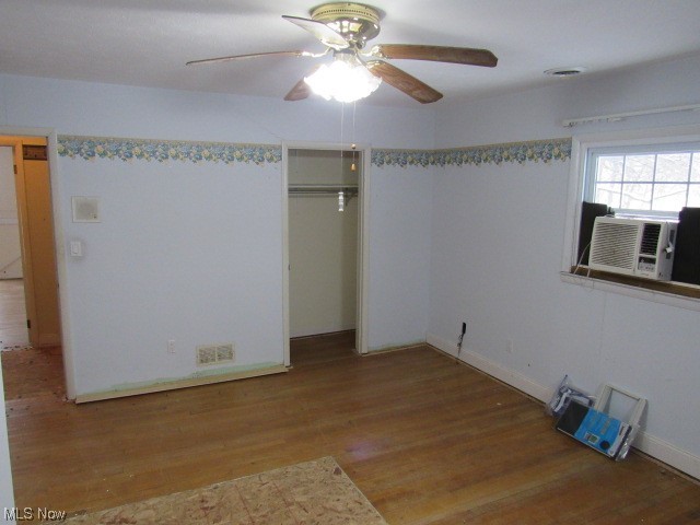 3102 State Road Vermilion, OH 44089 - Photo 38 of 45 Unfurnished bedroom featuring light hardwood / wood-style floors, a closet, and ceiling fan