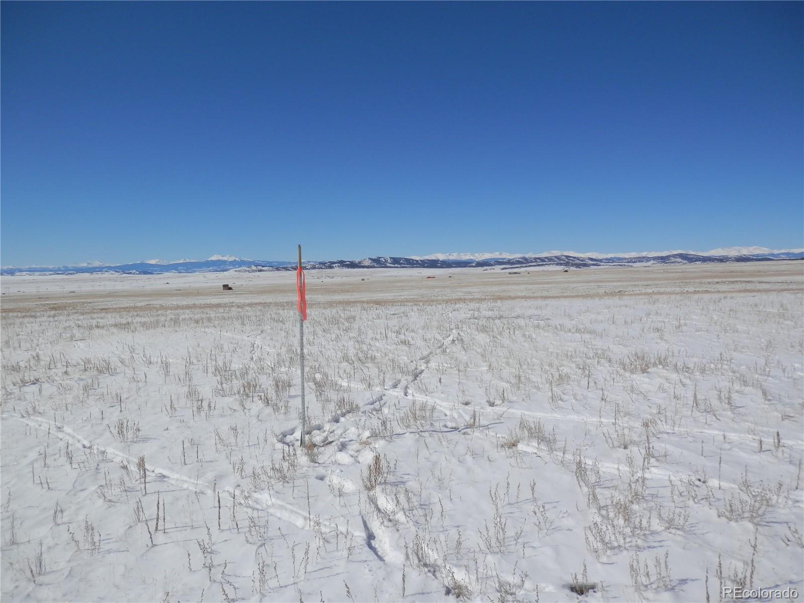6744 Mesa Road Hartsel, CO 80449 - Photo 12 of 23 a view of a dry yard with wooden fence