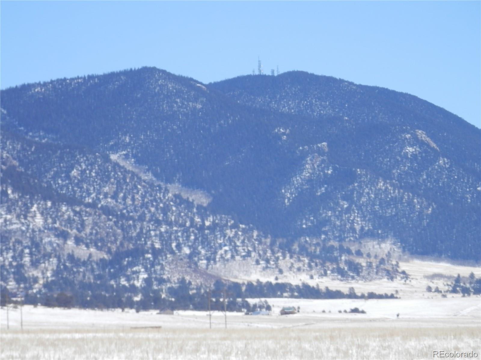 6744 Mesa Road Hartsel, CO 80449 - Photo 21 of 23 a view of a house with a mountain