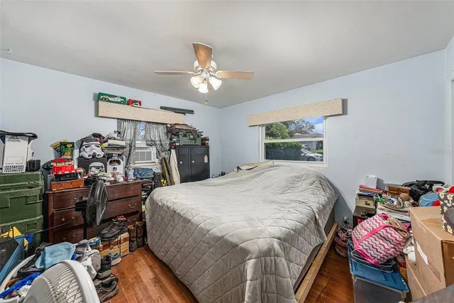 a bed room with a bed and a tv