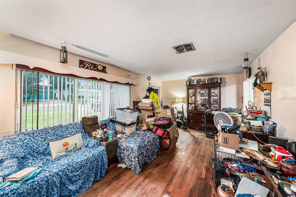 1580 Tuscola Road Clearwater, FL 33756 - Photo 2 of 15 a living room with furniture and a window
