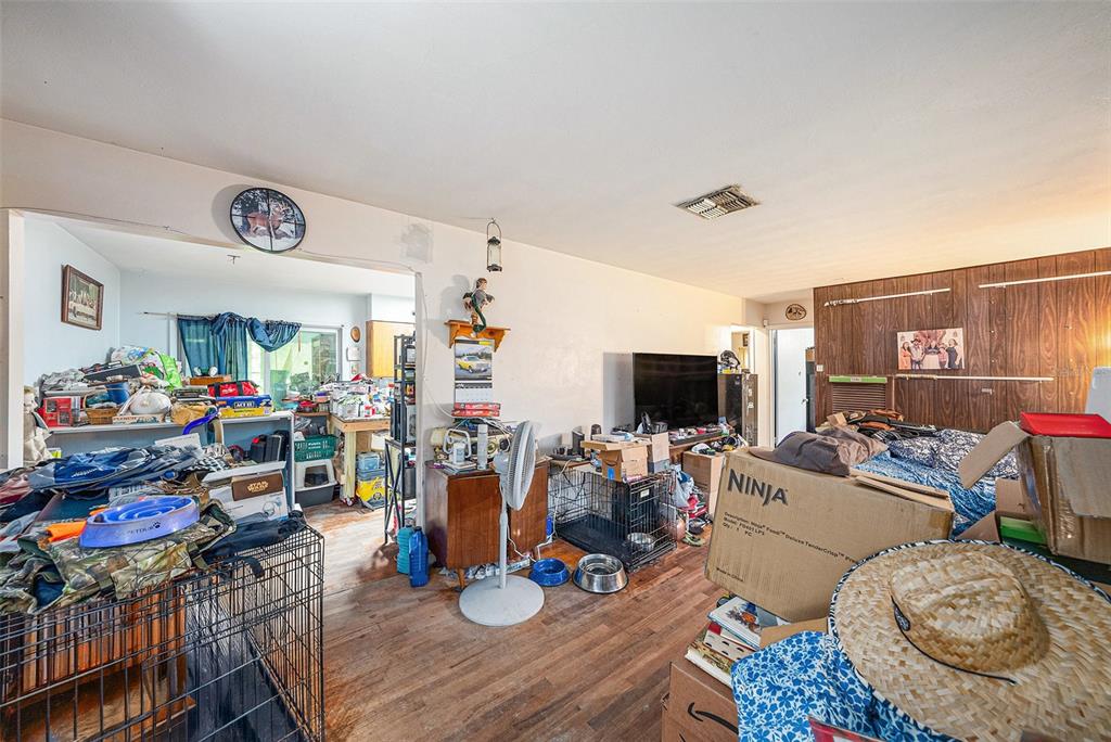 1580 Tuscola Road Clearwater, FL 33756 - Photo 4 of 15 a living room with furniture and a flat screen tv