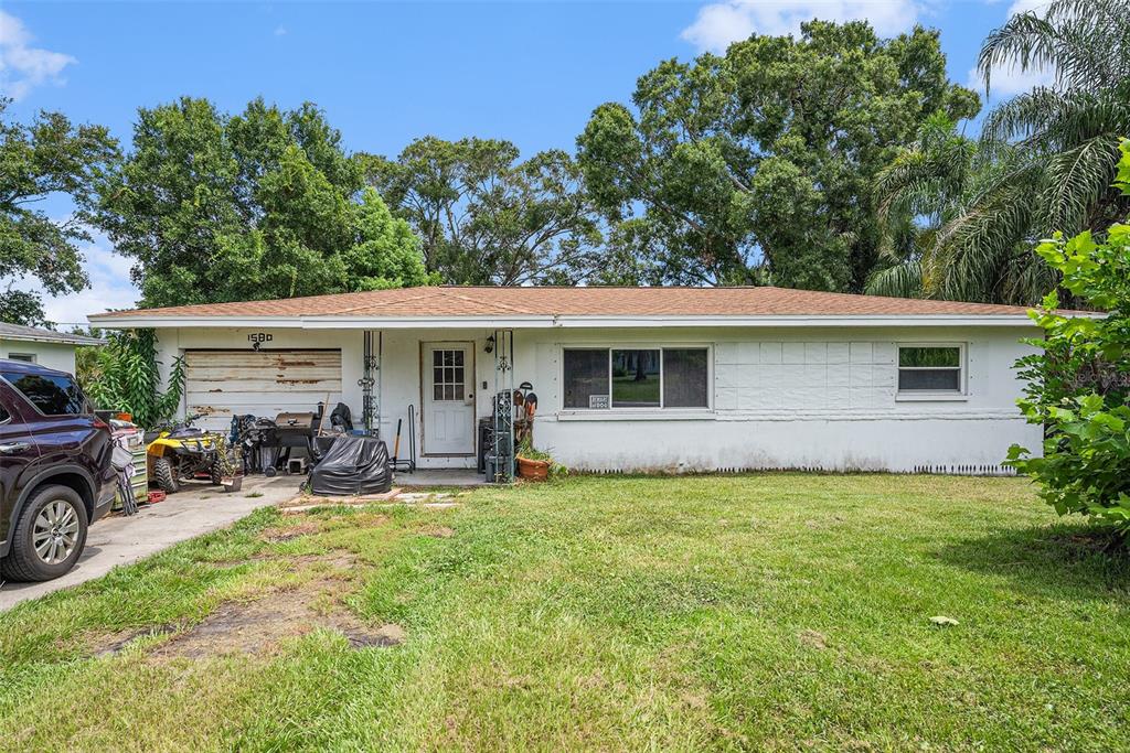 1580 Tuscola Road Clearwater, FL 33756 - Photo 6 of 15 a view of a house with a patio