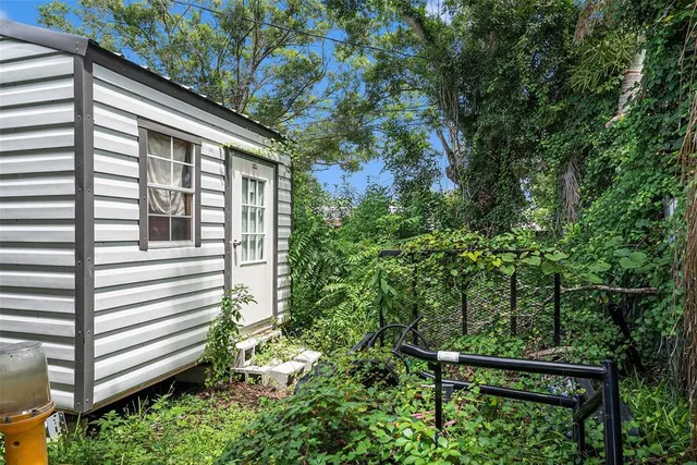 a view of a house with a tree