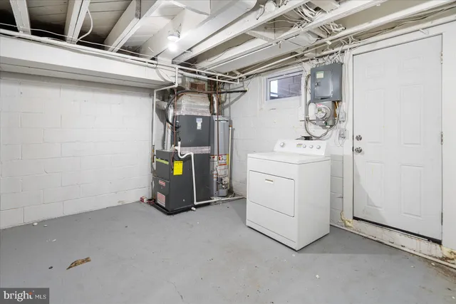 a view of storage and utility room with washer and dryer