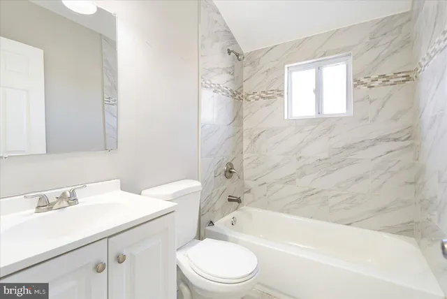 a bathroom with a sink a toilet and a bathtub