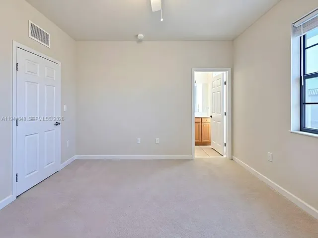 a view of a bathroom from a hallway
