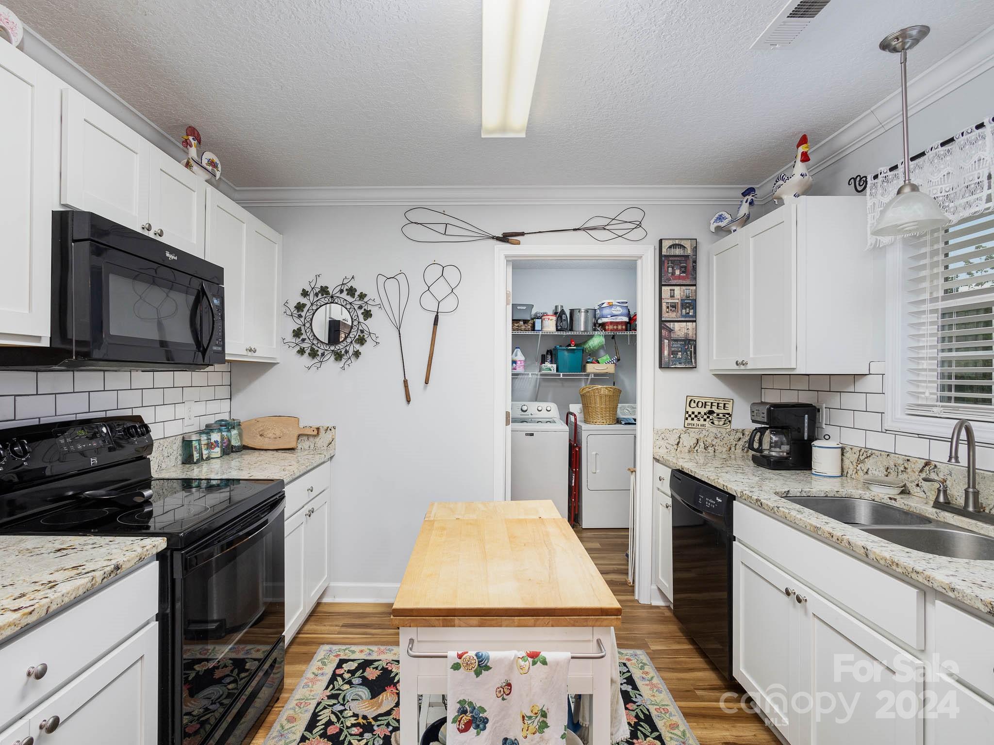 249 Springlake Road York, SC 29745 - Photo 7 of 20 a kitchen with stainless steel appliances granite countertop a sink stove and refrigerator