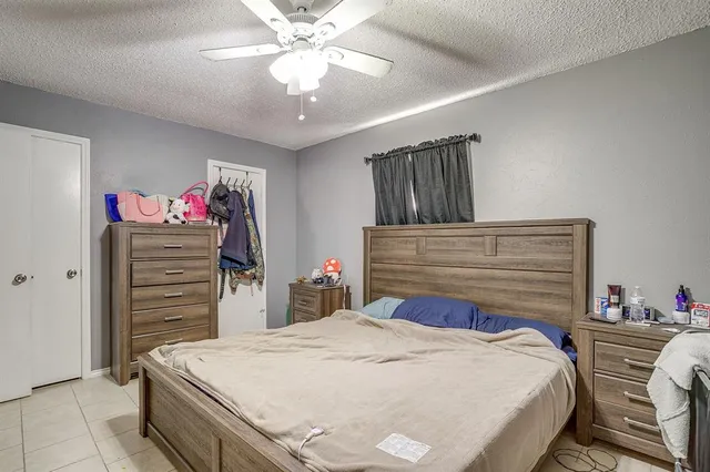 a bedroom with a bed and a closet
