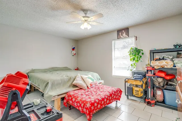 a bedroom with a bed and cabinets
