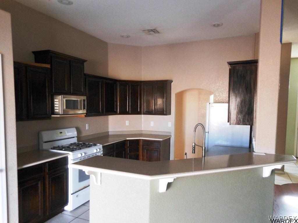 2135 Jamie Road Fort Mohave, AZ 86426 - Photo 8 of 18 Breakfast Bar Dark Wood