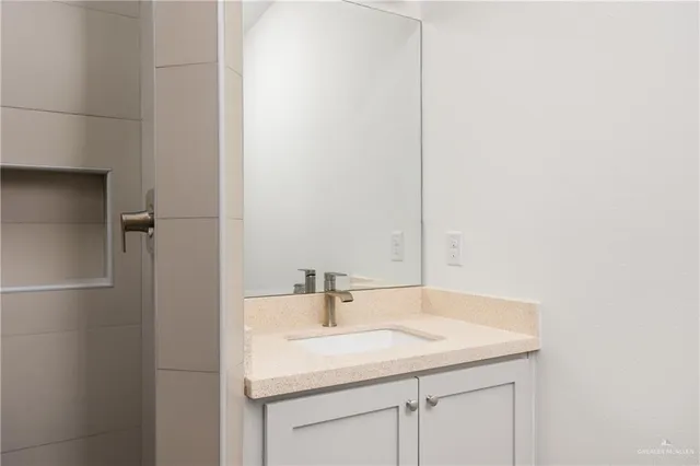 a bathroom with a sink and a mirror