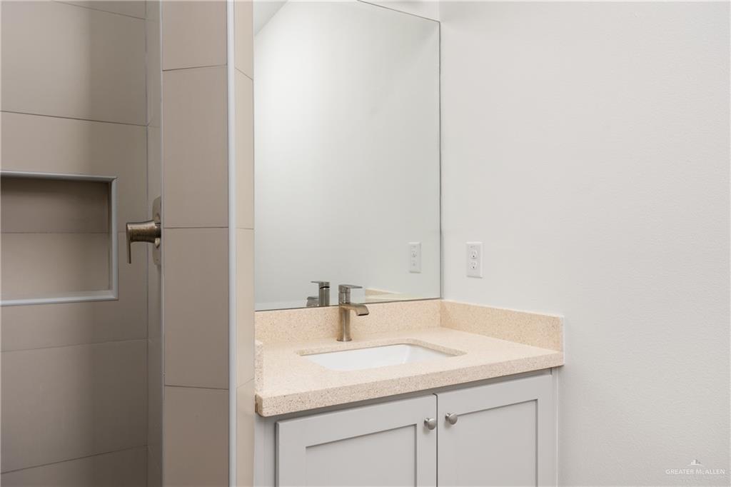 524 King Road, Unit 18 San Juan, TX 78589 - Photo 10 of 12 a bathroom with a sink and a mirror