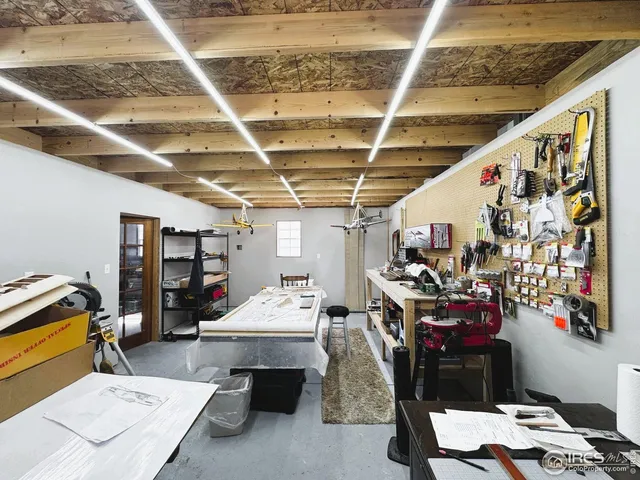 a view of a chairs and table in a room