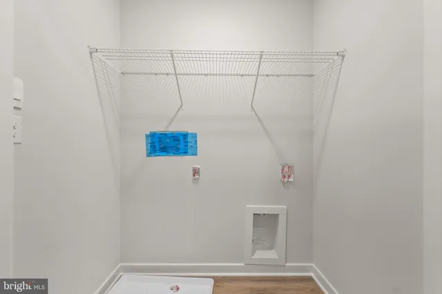 an empty room with a bathroom and sink