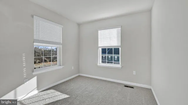 an outdoor space with swimming pool and furniture