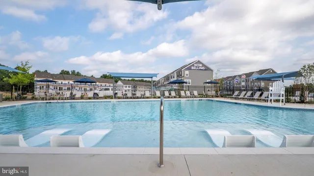 a view of a swimming pool with a patio