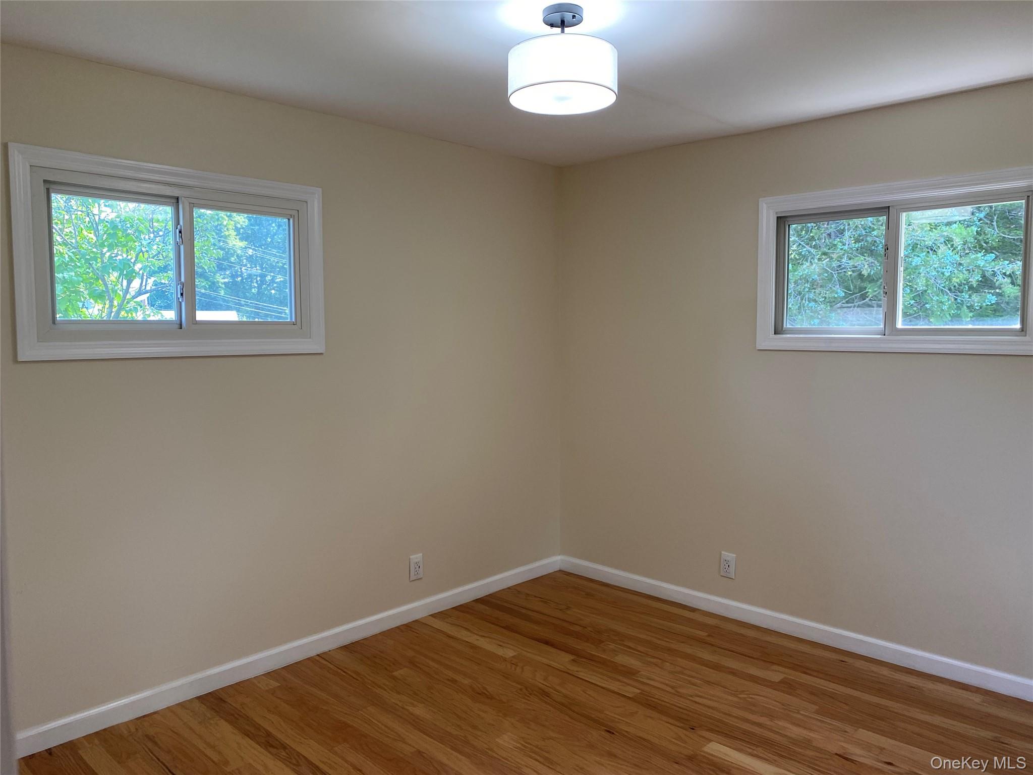 5 Smith Road Cornwall, NY 12518 - Photo 26 of 32 Bedroom 2 with light hardwood flooring and baseboards