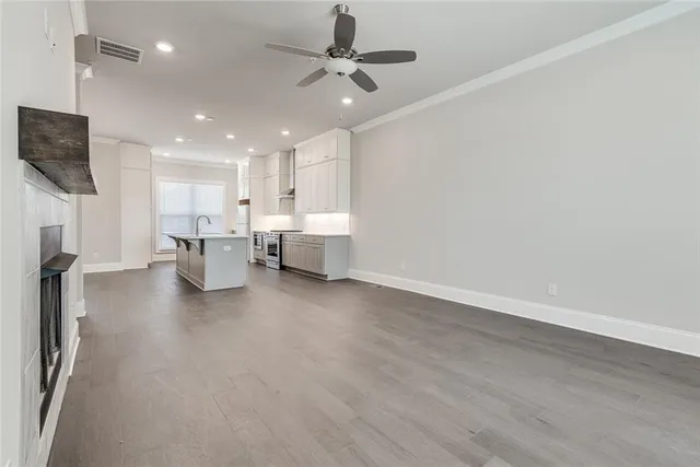 a view of kitchen with furniture and wooden floor