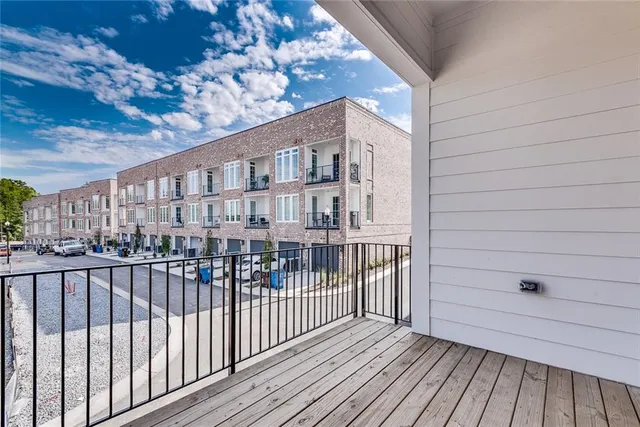 a view of a balcony with wooden floor