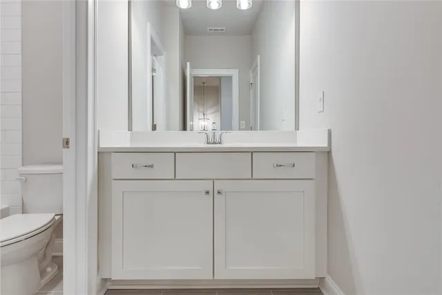 a bathroom with a sink and a toilet