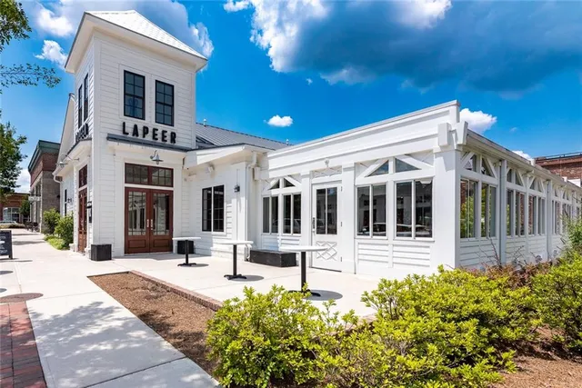 a front view of a house with a porch