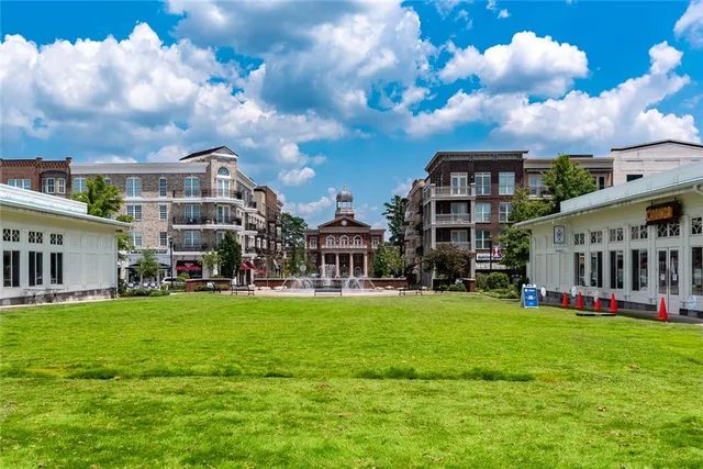 a view of a building with a yard
