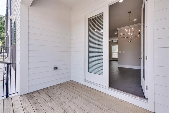 an empty room with wooden floor