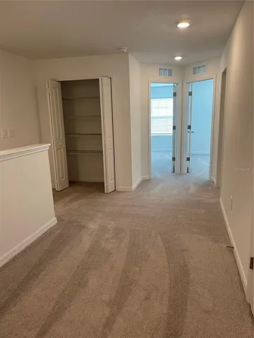a bathroom with a glass door shower