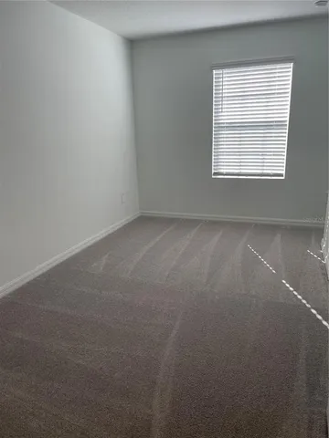 a white toilet sitting next to a bath tub