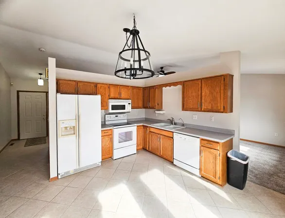 a view of a kitchen with white cabinets