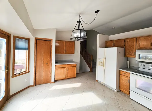 a view of empty room with wooden ceiling