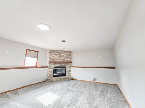 a bathroom with a sink a toilet a mirror and shower