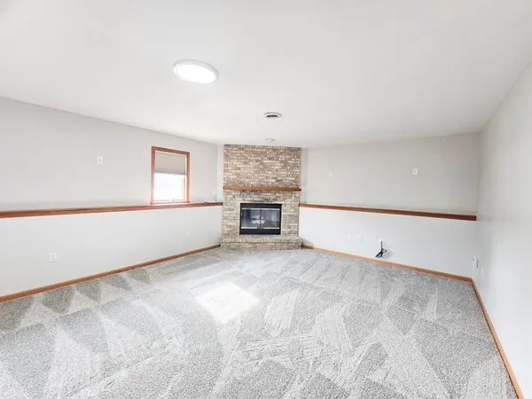 an empty room with a empty space and a window