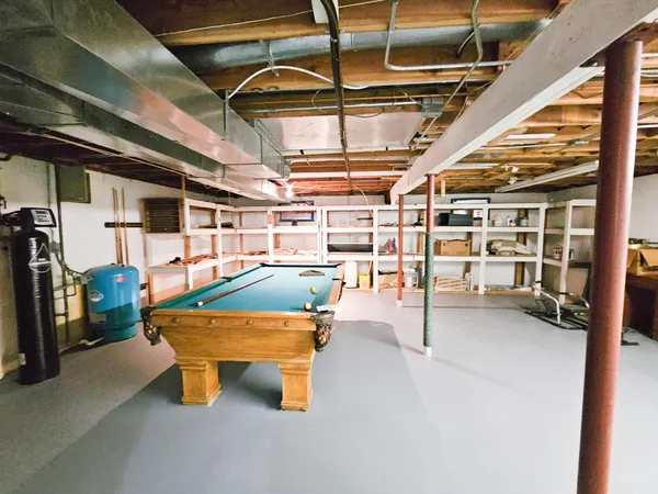 a view of an empty room with windows