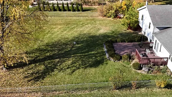 a large kitchen with stainless steel appliances granite countertop a stove a refrigerator and a sink