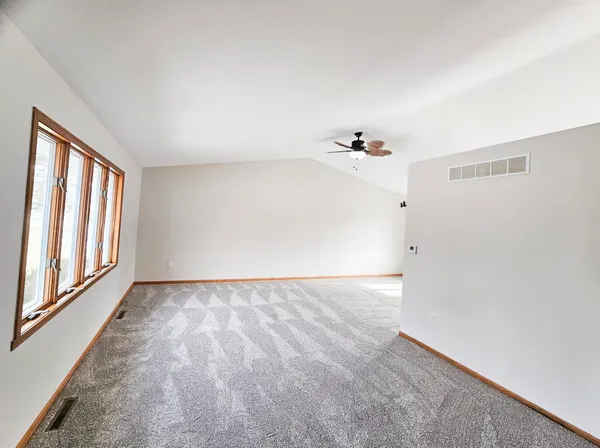 a view of an empty room and window