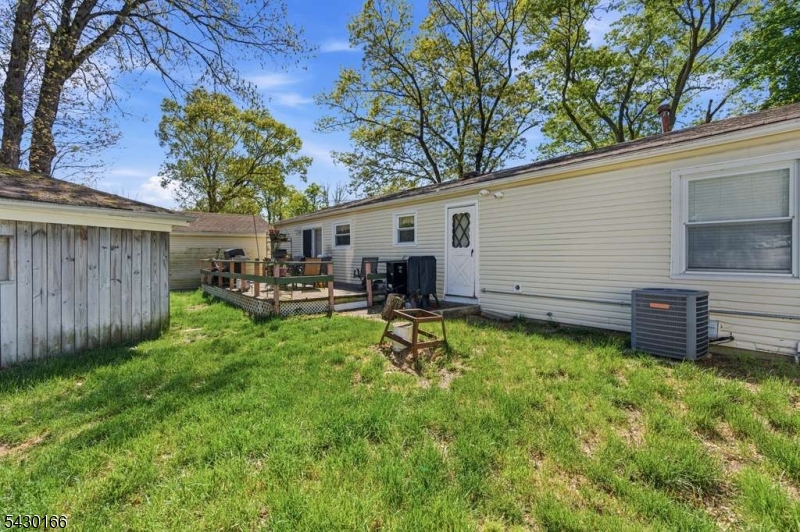 38 Clark Drive Howell, NJ 07731 - Photo 6 of 15 a view of a backyard with a sitting area