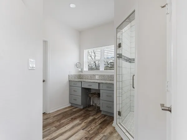 a room with a fireplace and a window