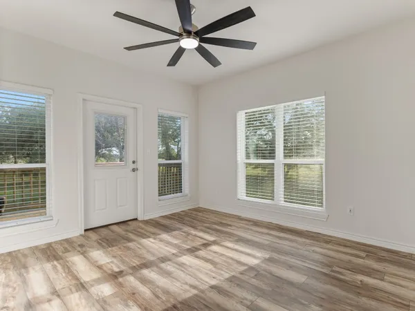 a view of an empty room with a window