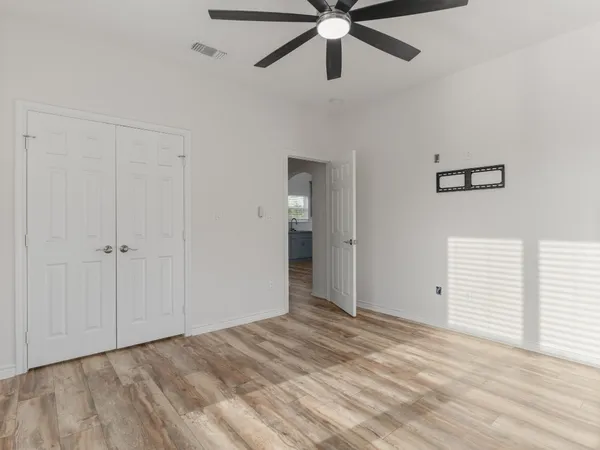a bathroom with a granite countertop toilet a sink and bathtub