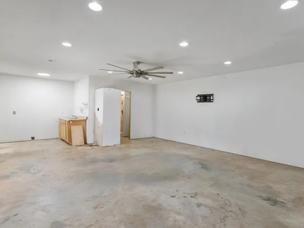 a white toilet sitting next to a bathroom sink