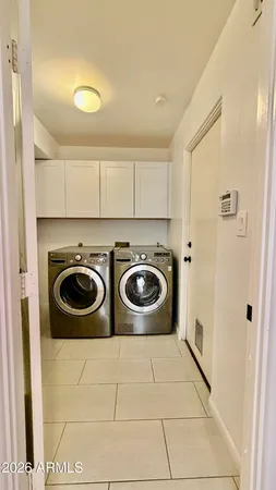 a utility room with dryer and washer