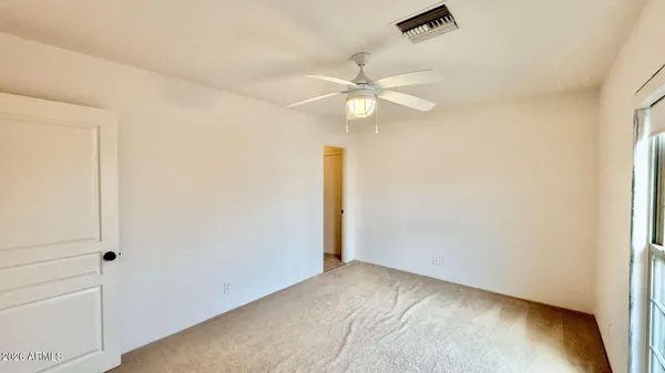 a view of a house with a small yard and plants
