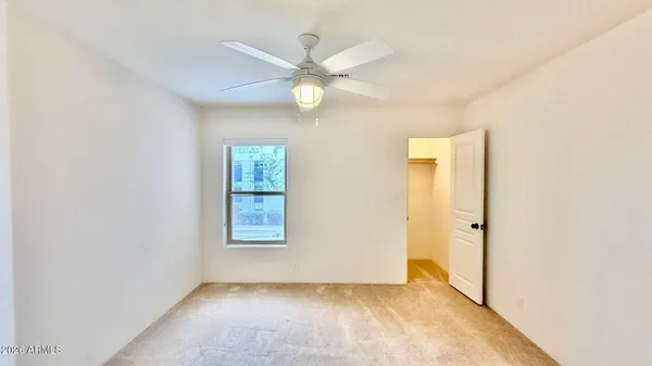 a bathroom with a granite countertop sink a mirror and a shower