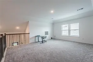 a view of a livingroom with furniture and a window